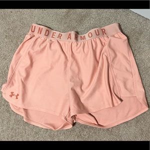 coral pink colored under armor loose fit athletic shorts